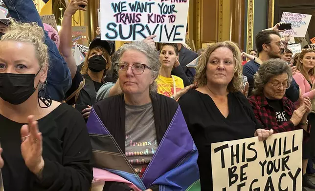 Protesters filled the Iowa state Capitol in Des Moines on Monday, Feb. 24, 2025, to denounce a bill that would strip the state civil rights code of protections based on gender identity. (AP Photo/Hannah Fingerhut)