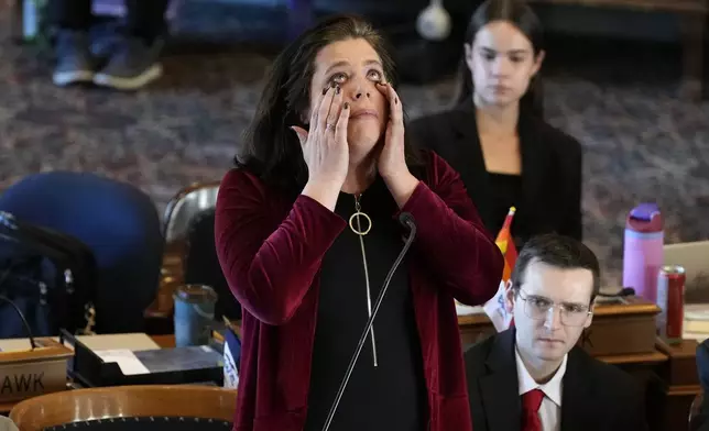 Rep. Aime Wichtendahl, D-Hiawatha, reacts as she speaks during debate on the gender identity bill, Thursday, Feb. 27, 2025, at the Statehouse in Des Moines, Iowa. (AP Photo/Charlie Neibergall)