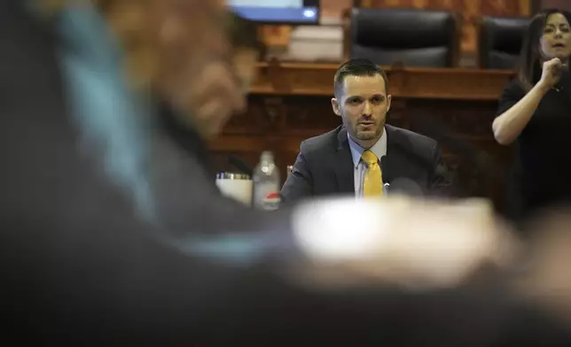 Lawmakers are present to vote on a bill that would strip the state civil rights code of protections based on gender identity, Thursday, Feb. 27, 2025, in Des Moines, Iowa. (AP Photo/Charlie Neibergall)