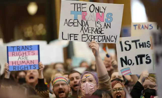 Protesters fill the Iowa state Capitol to denounce a bill that would strip the state civil rights code of protections based on gender identity, Thursday, Feb. 27, 2025, in Des Moines, Iowa. (AP Photo/Charlie Neibergall)