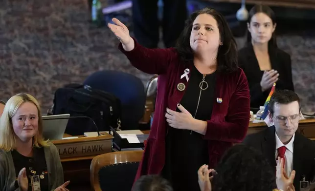 Rep. Aime Wichtendahl, D-Hiawatha, reacts to the gallery after speaking during debate on the gender identity bill, Thursday, Feb. 27, 2025, at the Statehouse in Des Moines, Iowa. (AP Photo/Charlie Neibergall)