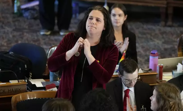 Rep. Aime Wichtendahl, D-Hiawatha, reacts to the gallery after speaking during debate on the gender identity bill, Thursday, Feb. 27, 2025, at the Statehouse in Des Moines, Iowa. (AP Photo/Charlie Neibergall)