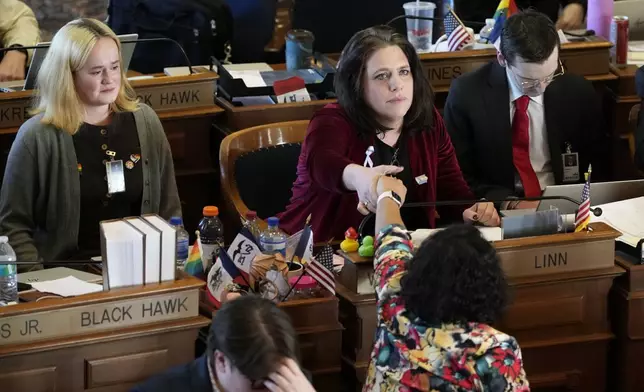 Rep. Aime Wichtendahl, D-Hiawatha, reacts after speaking during debate on the gender identity bill, Thursday, Feb. 27, 2025, at the Statehouse in Des Moines, Iowa. (AP Photo/Charlie Neibergall)