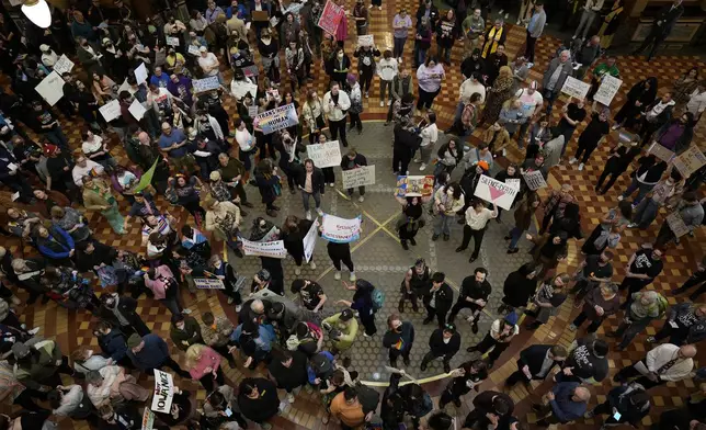 Protesters fill the Iowa state Capitol in Des Moines to denounce a bill that would strip the state civil rights code of protections based on gender identity, Thursday, Feb. 27, 2025, in Des Moines, Iowa. (AP Photo/Charlie Neibergall)