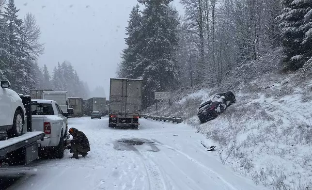 This photo provided by the Washington State Department of Transportation vehicles piled up on a snowy Interstate 5 highway in Southwestern Wash., Thursday, Feb. 13, 2025. (Washington State Department of Transportation via AP)