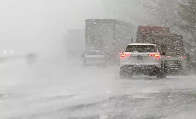 In this image provided by the Multnomah County Sheriff's Office, officials respond to a more than 100-vehicle pileup in whiteout conditions on westbound Interstate 84 on Thursday, Feb. 13, 2025, near Multnomah Falls, Ore. (Multnomah County Sheriff's Office via AP)