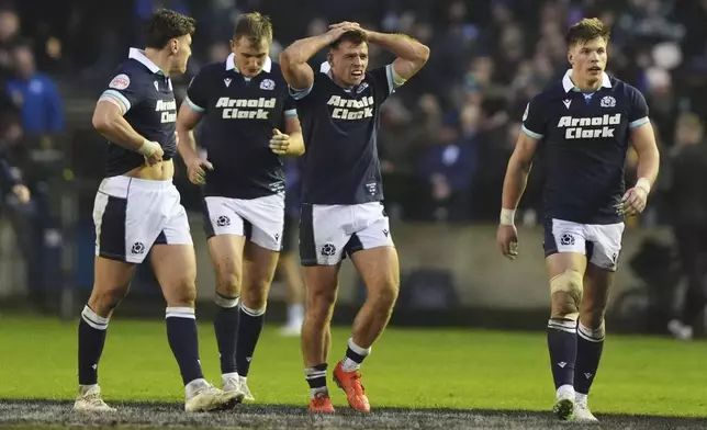 Scotland's Ben White reacts after scoring a try during the Six Nations match between Scotland and Ireland at Murrayfield Stadium, Edinburgh, Sunday Feb. 9, 2025. (Andrew Milligan/PA via AP)