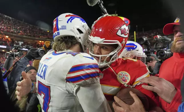 Buffalo Bills quarterback Josh Allen, left, and Kansas City Chiefs quarterback Patrick Mahomes hug after the AFC Championship NFL football game, Sunday, Jan. 26, 2025, in Kansas City, Mo. (AP Photo/Charlie Riedel)