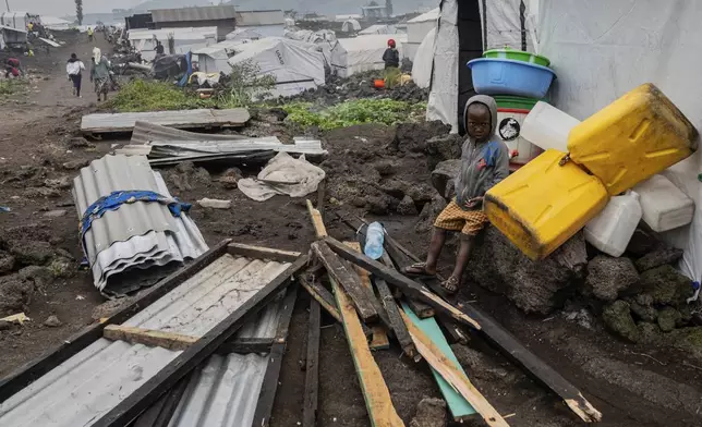 A child displaced by the fighting between M23 rebels and government soldiers prepare to leave the camp following an instruction by M23 rebels in Goma, Democratic Republic of the Congo, Tuesday, Feb. 11, 2025. (AP Photo/Moses Sawasawa)