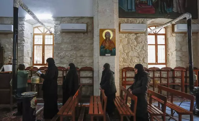 Syrian nuns pray at the Greek Orthodox Convent of Saint Thecla in the town of Maaloula, Syria, Sunday Jan. 12, 2025. (AP Photo/Omar Sanadiki)
