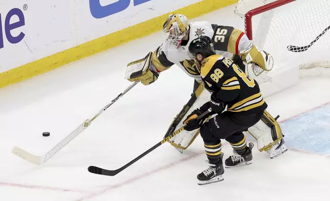 Vegas Golden Knights goaltender Ilya Samsonov (35) defends the net against Boston Bruins right wing David Pastrnak (88) during the second period of an NHL hockey game, Saturday, Feb. 8, 2025, in Boston. (AP Photo/Mark Stockwell)