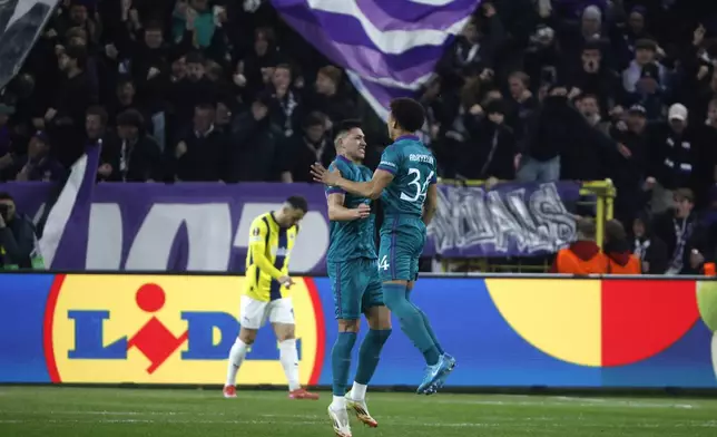 Anderlecht's Luis Vazquez, center, celebrates with Anderlecht's Adryelson, right, after scoring his sides second goal during the Europa League playoff second leg soccer match between Anderlecht and Fenerbahce at the RSC Anderlecht stadium in Brussels, Thursday, Feb. 20, 2025. (AP Photo/Omar Havana)