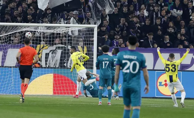 Fenerbahce's Youssef En-Nesyri, center, scores the opening goal during the Europa League playoff second leg soccer match between Anderlecht and Fenerbahce at the RSC Anderlecht stadium in Brussels, Thursday, Feb. 20, 2025. (AP Photo/Omar Havana)