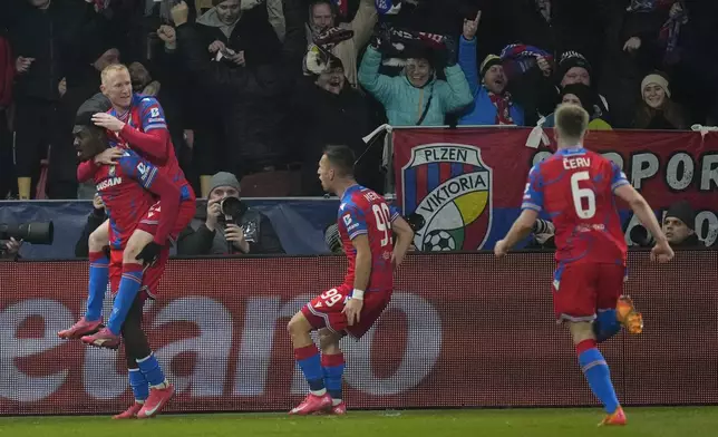 Plzen players celebrate after a goal during the Europa League playoff second leg soccer match between Viktoria Plzen and Ferencvaros at the Doosan Arena in Plzen, Czech Republic, Thursday, Feb. 20, 2025. (AP Photo/Petr David Josek)