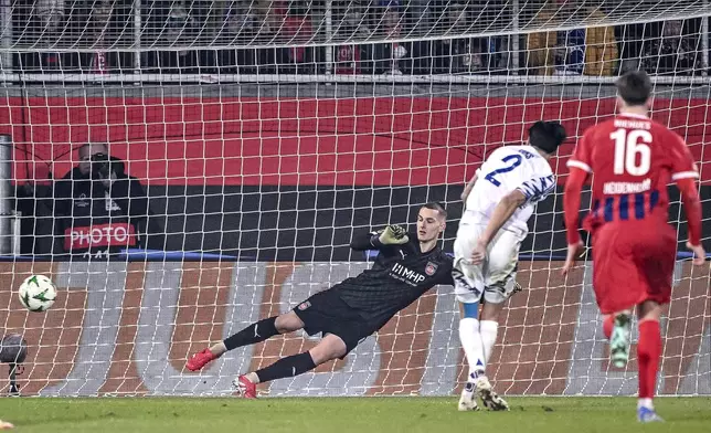 Copenhagen's Kevin Diks, second right, scores his side's second goal during a Conference League playoff match between FC Heidenheim 1846 and FC Copenhagen in Heidenheim, Germany, Thursday, Feb. 20, 2025. (Harry Langer/dpa via AP)