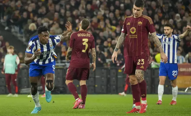 Porto's Samu Omorodion, left, celebrates after scoring the opening goal during the Europa League playoff second leg soccer match between Roma and Porto at the Stadio Olimpico in Rome, Italy, Thursday, Feb. 20, 2025. (AP Photo/Gregorio Borgia)