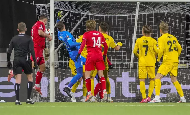 Twente's Michal Sadilek hits the post during the Europa League soccer match between FK Bodø/Glimt and FC Twente in Bodo, Norway, Thursday, Feb. 20, 2025. (Fredrik Varfjell/NTB Scanpix via AP)