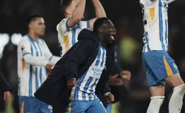 Brighton's Yankuba Minteh celebratees after the English Premier League soccer match between Brighton and Chelsea in Brighton, England, Friday, Feb. 14, 2025. (AP Photo/Dave Shopland)