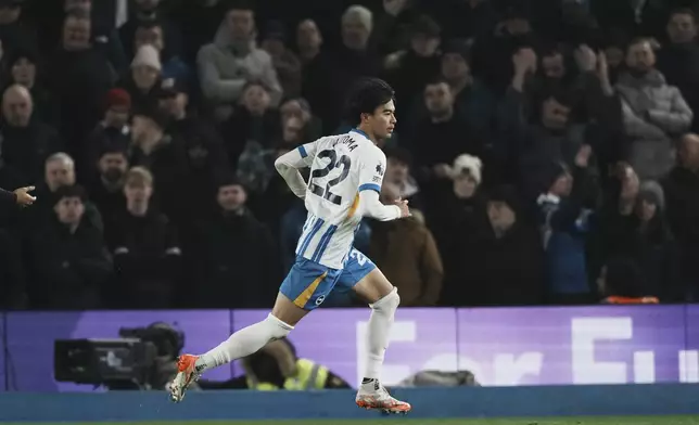 Brighton's Kaoru Mitoma runs after he scored during the English Premier League soccer match between Brighton and Chelsea in Brighton, England, Friday, Feb. 14, 2025. (AP Photo/Dave Shopland)