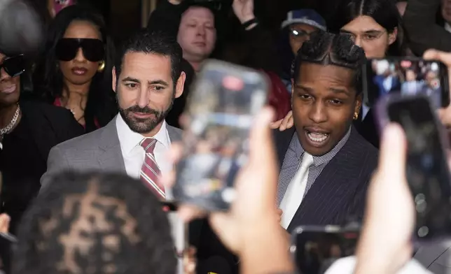 A$AP Rocky, right, speaks next to attorney Chad Seigel after he was found not guilty in his trial Tuesday, Feb. 18, 2025, in Los Angeles. (AP Photo/Damian Dovarganes)