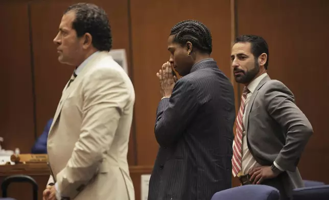 A$AP Rocky, center, waits for his verdict to be read during his trial Tuesday, Feb. 18, 2025, in Los Angeles. (Daniel Cole/Pool Photo via AP)