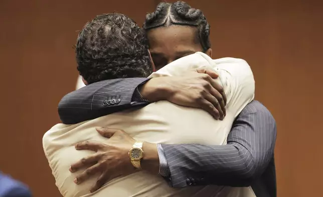 A$AP Rocky hugs attorney Joe Tacopina after he was found not guilty during his trial Tuesday, Feb. 18, 2025, in Los Angeles. (Daniel Cole/Pool Photo via AP)