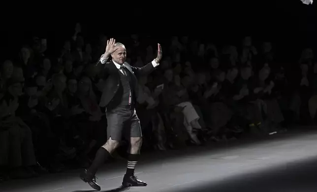 Designer Thom Browne accepts applause after the Thom Browne Fall/Winter 2025 fashion show as part of New York Fashion Week on Tuesday, Feb. 11, 2025, at The Shed in New York. (Photo by Evan Agostini/Invision/AP)