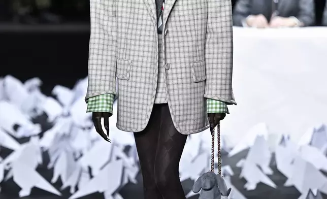 A model walks the runway during the Thom Browne Fall/Winter 2025 fashion show as part of New York Fashion Week on Tuesday, Feb. 11, 2025, at The Shed in New York. (Photo by Evan Agostini/Invision/AP)