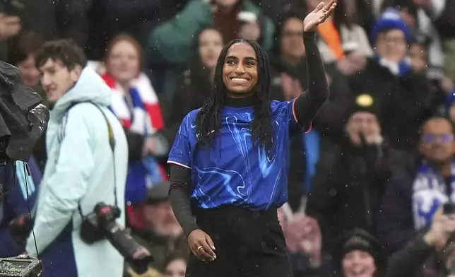 Chelsea new signing Naomi Girma is introduced to the fans ahead of the Women's Super League soccer match between Chelsea Women and Arsenal Women at Stamford Bridge, London, Sunday Jan. 26, 2025. (Bradley Collyer/PA via AP)