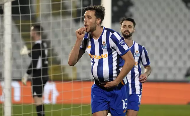 Porto's Nico Gonzalez celebrates after scoring the opening goal during the Europa League opening phase soccer match between Maccabi Tel Aviv and Porto, at the Partizan stadium, in Belgrade, Serbia, Thursday, Jan. 30, 2025. (AP Photo/Darko Vojinovic)