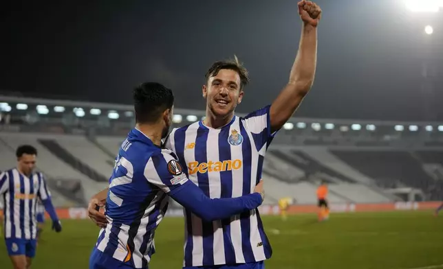 Porto's Nico Gonzalez celebrates after scoring the opening goal during the Europa League opening phase soccer match between Maccabi Tel Aviv and Porto, at the Partizan stadium, in Belgrade, Serbia, Thursday, Jan. 30, 2025. (AP Photo/Darko Vojinovic)