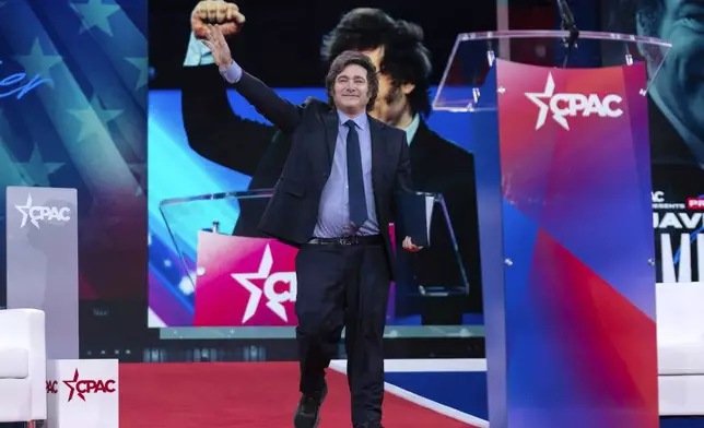 Argentina's President Javier Milei waves to the crowd before speaking at the Conservative Political Action Conference, CPAC, at the Gaylord National Resort &amp; Convention Center, Saturday, Feb. 22, 2025, in Oxon Hill, Md. (AP Photo/Jose Luis Magana)