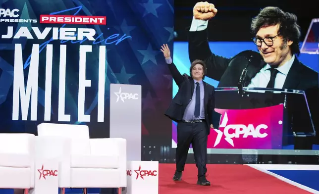 Argentina's President Javier Milei waves to the crowd before speaking at the Conservative Political Action Conference, CPAC, at the Gaylord National Resort &amp; Convention Center, Saturday, Feb. 22, 2025, in Oxon Hill, Md. (AP Photo/Jose Luis Magana)