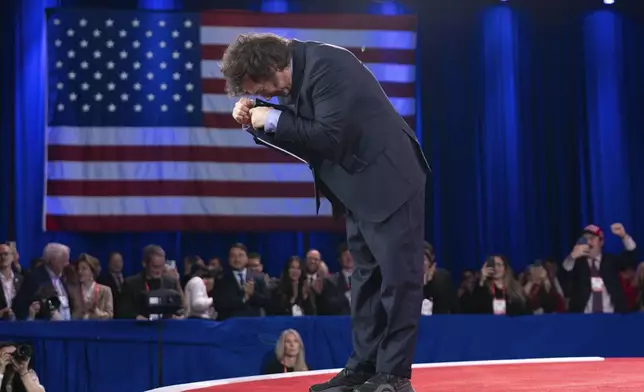 Argentina's President Javier Milei bows to the crowd before speaking at the Conservative Political Action Conference, CPAC, at the Gaylord National Resort &amp; Convention Center, Saturday, Feb. 22, 2025, in Oxon Hill, Md. (AP Photo/Jose Luis Magana)