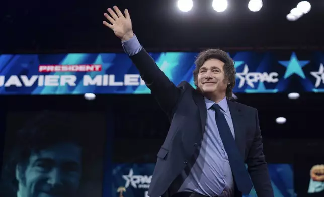 Argentina's President Javier Milei waves to the crowd before speaking at the Conservative Political Action Conference, CPAC, at the Gaylord National Resort &amp; Convention Center, Saturday, Feb. 22, 2025, in Oxon Hill, Md. (AP Photo/Jose Luis Magana)