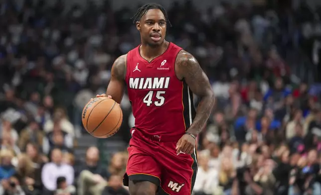 Miami Heat guard Davion Mitchell works the floor against the Dallas Mavericks during the first half of an NBA basketball game Thursday, Feb. 13, 2025, in Dallas. (AP Photo/Julio Cortez)