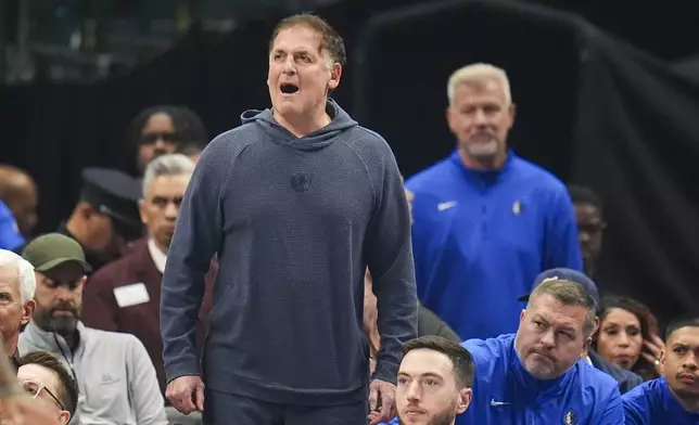 Mark Cuban reacts during the first half of an NBA basketball game between the Dallas Mavericks and the Miami Heat Thursday, Feb. 13, 2025, in Dallas. (AP Photo/Julio Cortez)