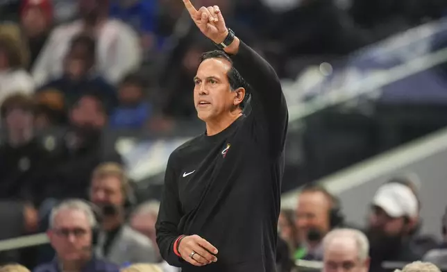 Miami Heat head coach Erik Spoelstra talks to his team during the first half of an NBA basketball game against the Dallas Mavericks Thursday, Feb. 13, 2025, in Dallas. (AP Photo/Julio Cortez)