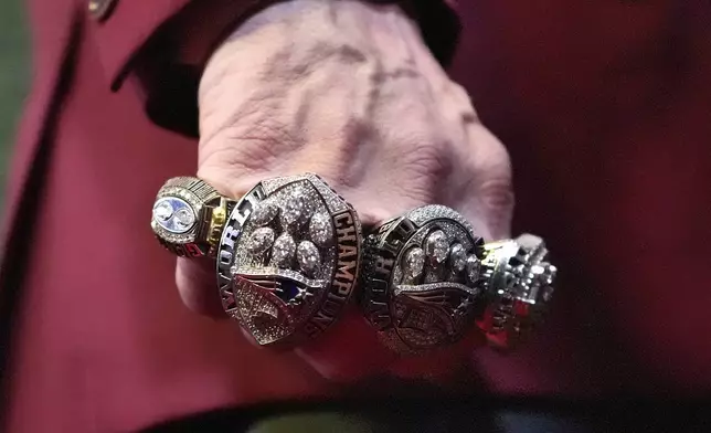 Former NFL head coach Bill Belichick shows his Super Bowl rings as he walks the red carpet at the NFL Honors award show ahead of the Super Bowl 59 football game, Thursday, Feb. 6, 2025, in New Orleans. (AP Photo/Brynn Anderson)