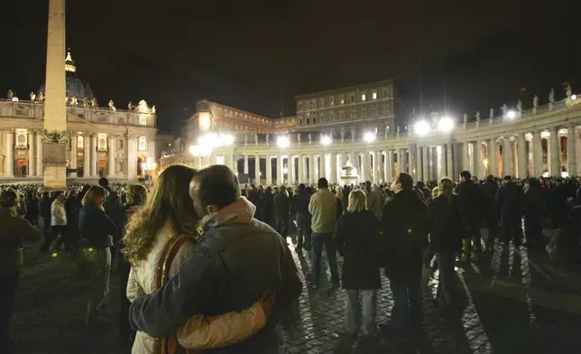 FILE - Faithful and pilgrims attend a rosary vigil prayer for Pope John Paul II's health in St. Peter's Square at The Vatican, Friday, April 1, 2005.(AP Photo/Luca Bruno, File )