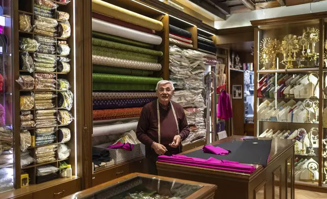 Raniero Mancinelli, a tailor who serves prelates and popes, works in his shop in Rome, Italy, Monday, Feb. 24, 2025. (AP Photo/Mosa'ab Elshamy)