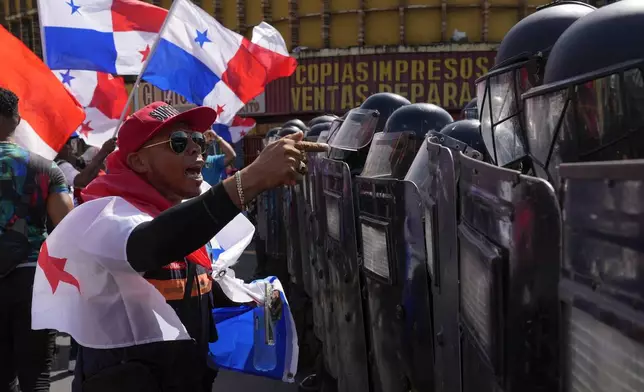 Police block protesters rallying against U.S. Secretary of State Marco Rubio's visit in Panama City, Sunday, Feb. 2, 2025. (AP Photo/Matias Delacroix)