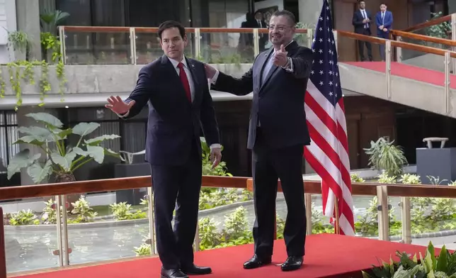 Secretary of State Marco Rubio, left, and Costa Rican President Rodrigo Chaves give a joint news conference at the presidential palace in San Jose, Costa Rica, Tuesday, Feb. 4, 2025. (AP Photo/Mark Schiefelbein, Pool)