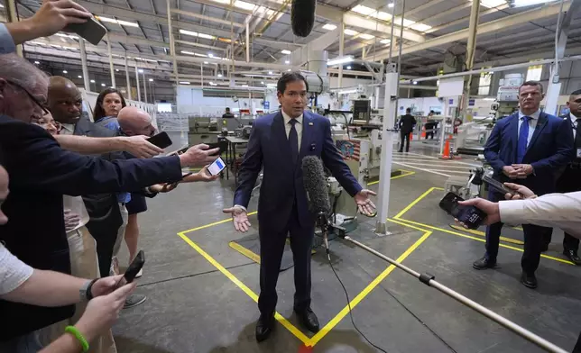 U.S. Secretary of State Marco Rubio speaks to the media during a visit to the aircraft maintenance firm Aeroman in San Luis Talpa, El Salvador, Monday, Feb. 3, 2025. (AP Photo/Mark Schiefelbein, Pool)