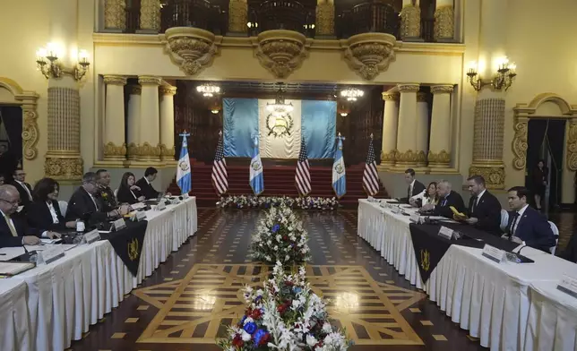 U.S. Secretary of State Marco Rubio, right, sits across from Guatemalan Foreign Affairs Minister Carlos Ramiro Martinez, left, and Vice President Karin Herrera during a meeting at the National Palace in Guatemala City, Wednesday, Feb. 5, 2025. (AP Photo/Mark Schiefelbein, Pool)