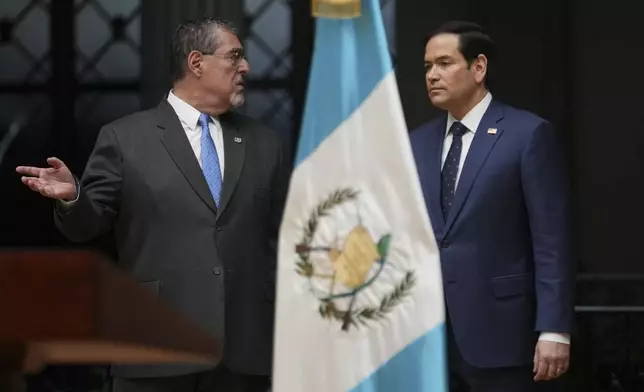 U.S. Secretary of State Marco Rubio, right, and Guatemalan President Bernardo Arevalo arrive to give a joint news conference at the National Palace in Guatemala City, Wednesday, Feb. 5, 2025. (AP Photo/Moises Castillo)
