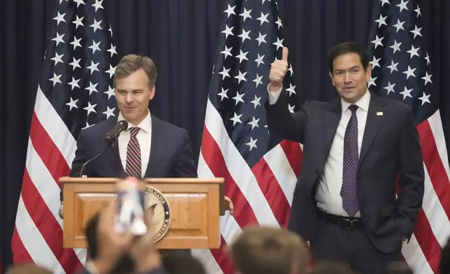 Chargé d'Affaires John Barrett of the United States Embassy introduces Secretary of State Marco Rubio to employees and families during a meet-and-greet in Panama City, Panama, Sunday, Feb. 2, 2025. (AP Photo/Mark Schiefelbein, Pool)