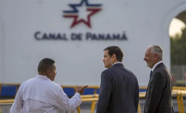 U.S. Secretary of State Marco Rubio, center, and Panama Canal Authority Administrator Ricuarte Vásquez, right, tour the Miraflores Locks at the Panama Canal in Panama City, Sunday, Feb. 2, 2025. (AP Photo/Mark Schiefelbein, Pool)