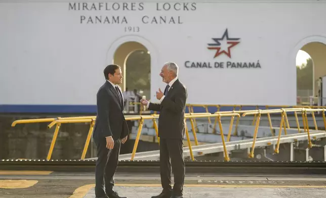 U.S. Secretary of State Marco Rubio, left, and Panama Canal Authority Administrator Ricuarte Vásquez talk during a tour of the Miraflores Locks in Panama City, Sunday, Feb. 2, 2025. (AP Photo/Mark Schiefelbein, Pool)