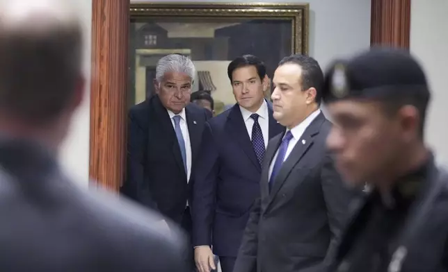 Panama's President Jose Mulino, left, and U.S. Secretary of State Marco Rubio arrive for a meeting at the presidential palace in Panama City, Sunday, Feb. 2, 2025. (AP Photo/Mark Schiefelbein, Pool)